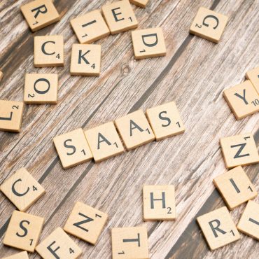 scrabble-letters-spelling-saas-on-a-wooden-tabl